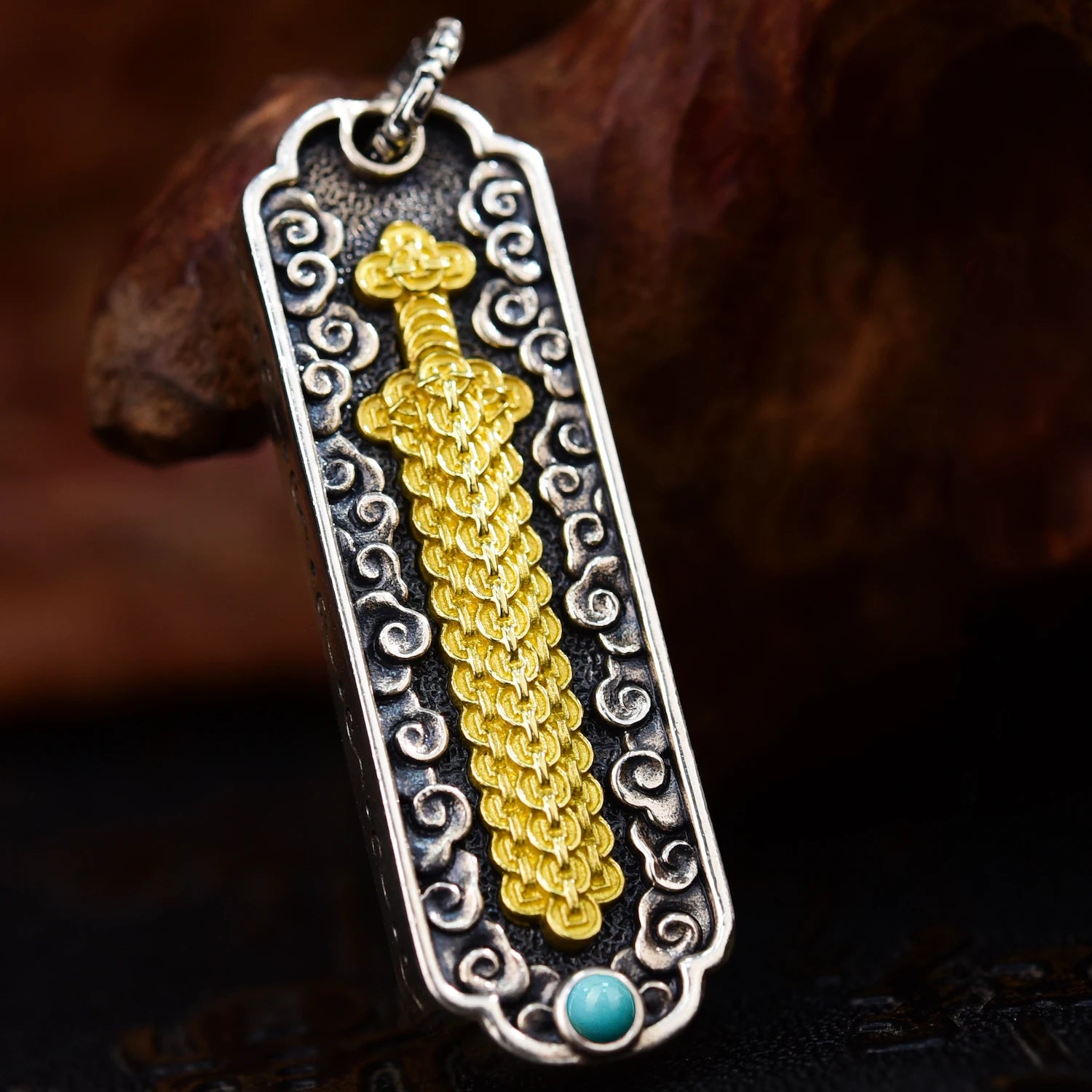 Coin Sword pendant front view — handcrafted coin sword charm with layered ancient coin motifs — DAO Chant