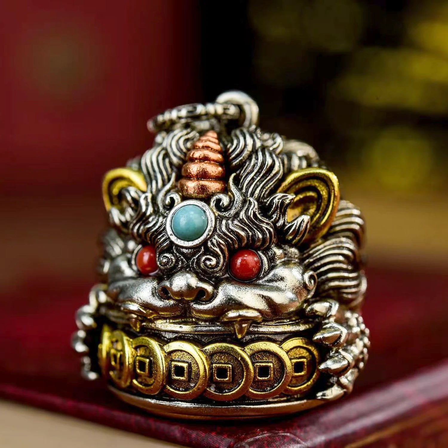 Pixiu Wealth Guardian pendant front view — detailed relief carving with wealth attraction symbolism — DAO Chant